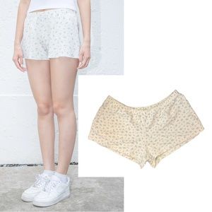 Brandy Melville ivory and powder blue floral shorts